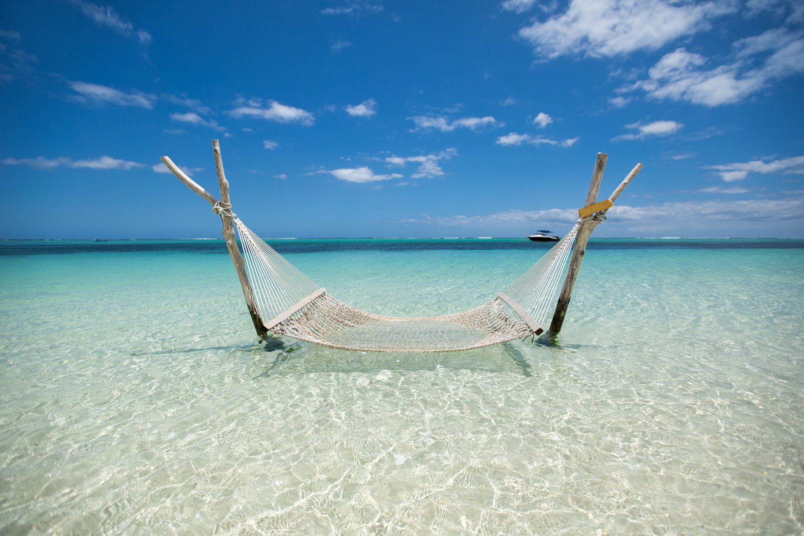 Hammock over turquoise Caribbean water near Mahahual